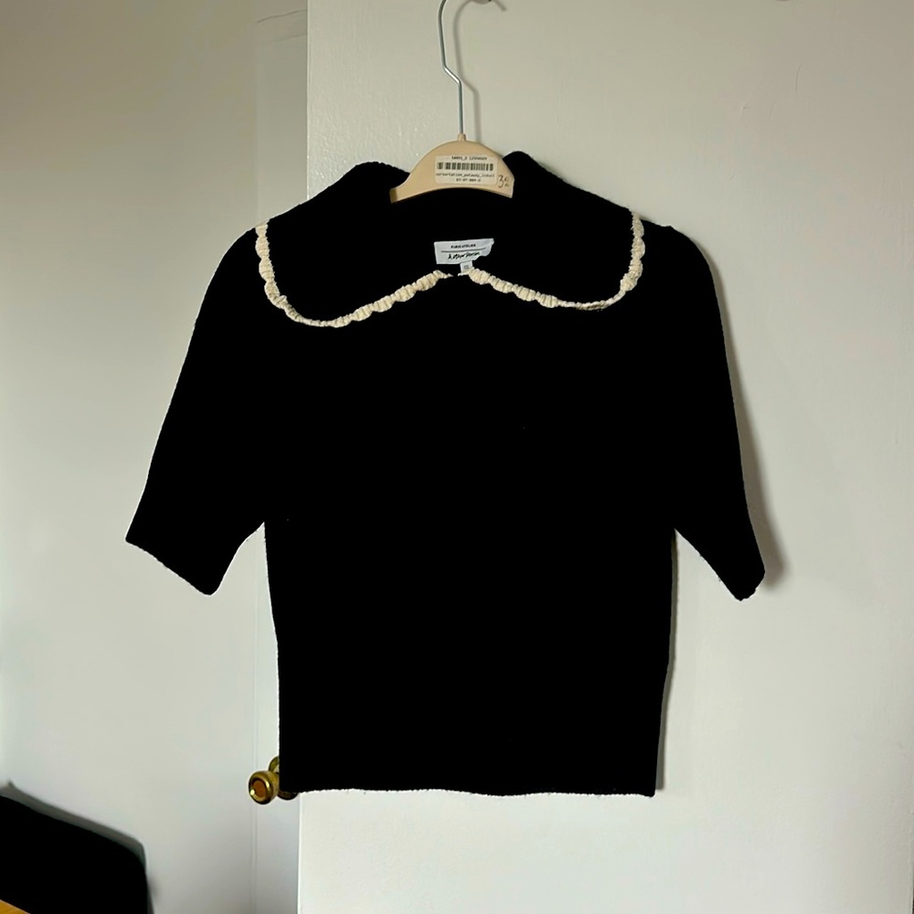 Black knitted sweater with white scalloped detail
Size medium 
Like new